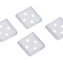 4 transparente Möbeluntersetzer 50x50 mm zum Schutz von Teppichen vor Möbelabdrücken.