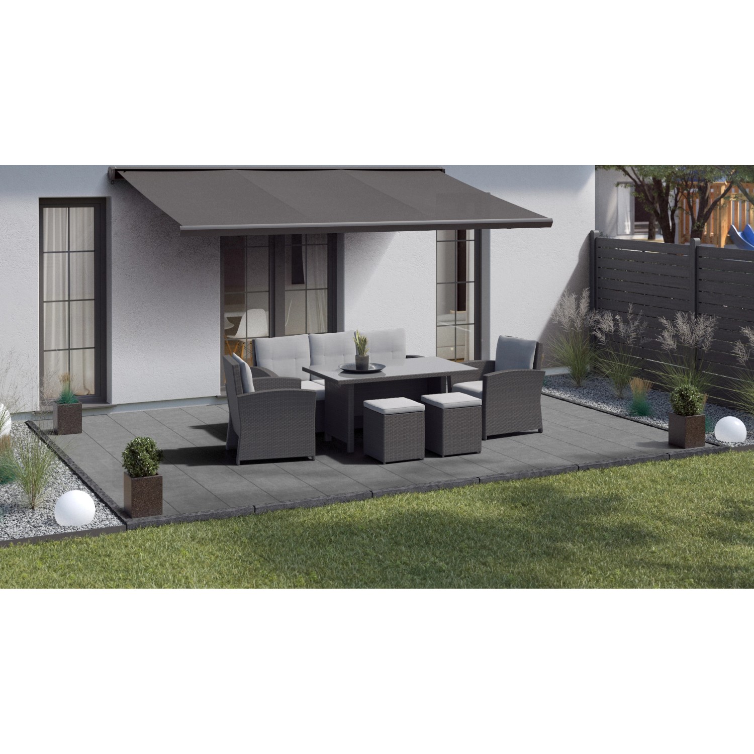 Terrasse mit grauen Palermo Betonplatten (40x40) und Gartenmöbeln.