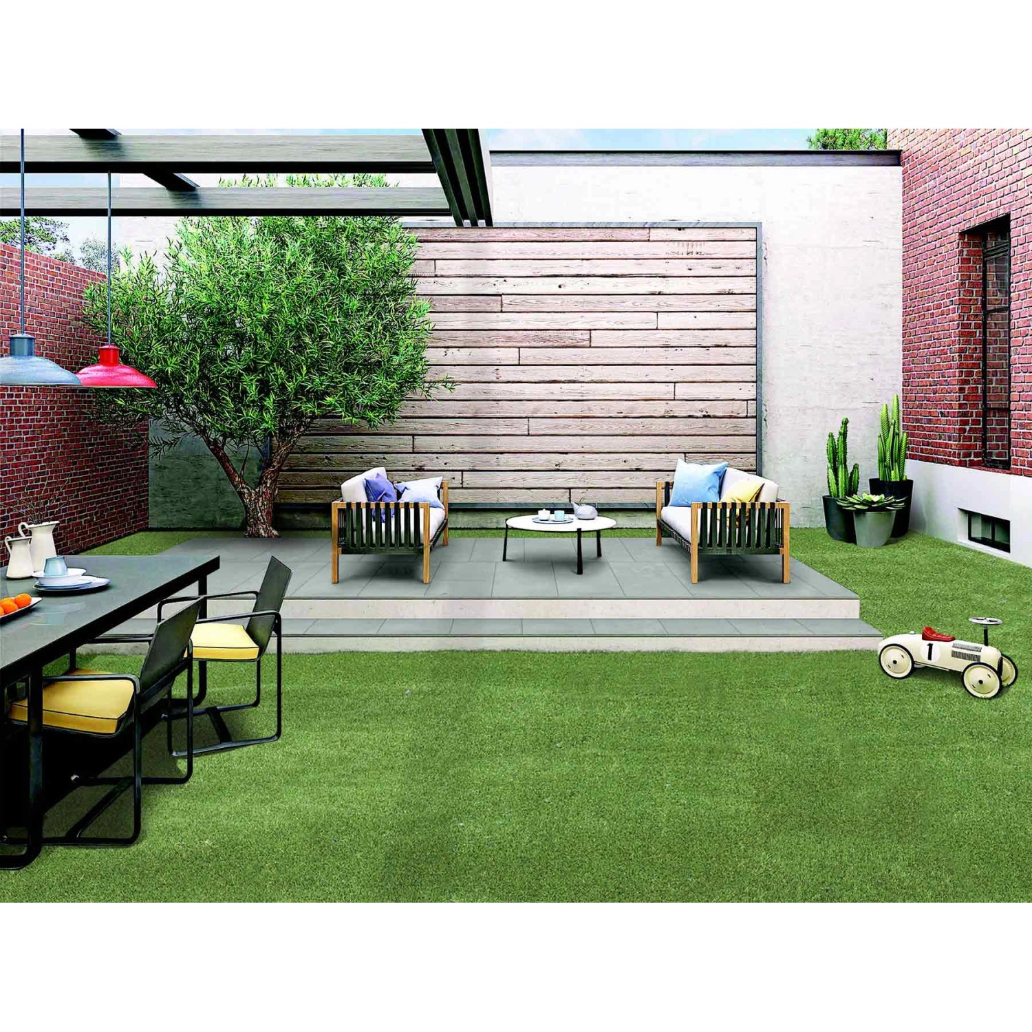 Satte, grüne Primaflor Kunstrasen Megan Fläche im Garten mit Möbeln und Dekoration.