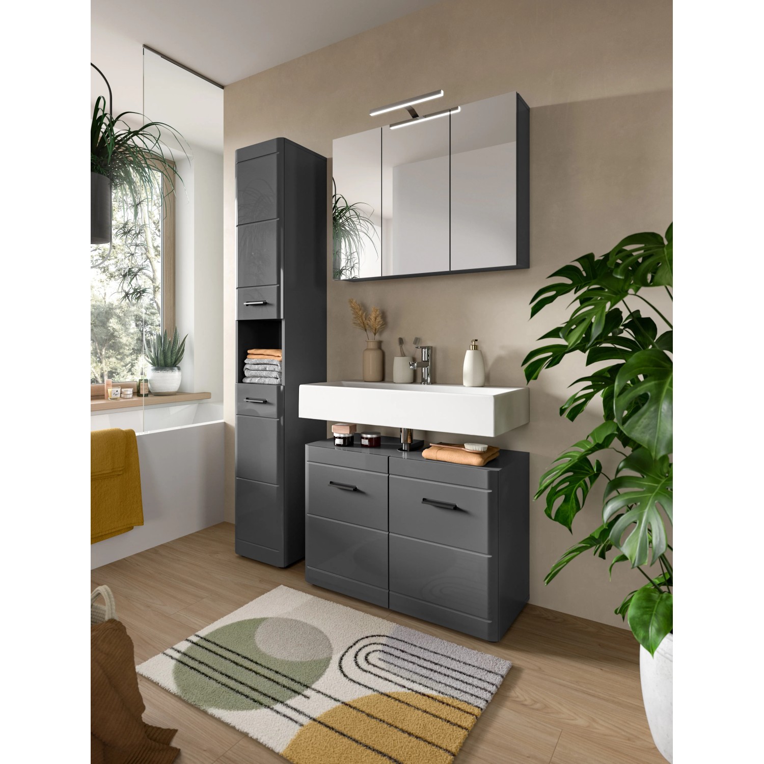 Grauer Waschbeckenunterschrank (80x56x34 cm) mit Schubladen im modernen Badezimmer.