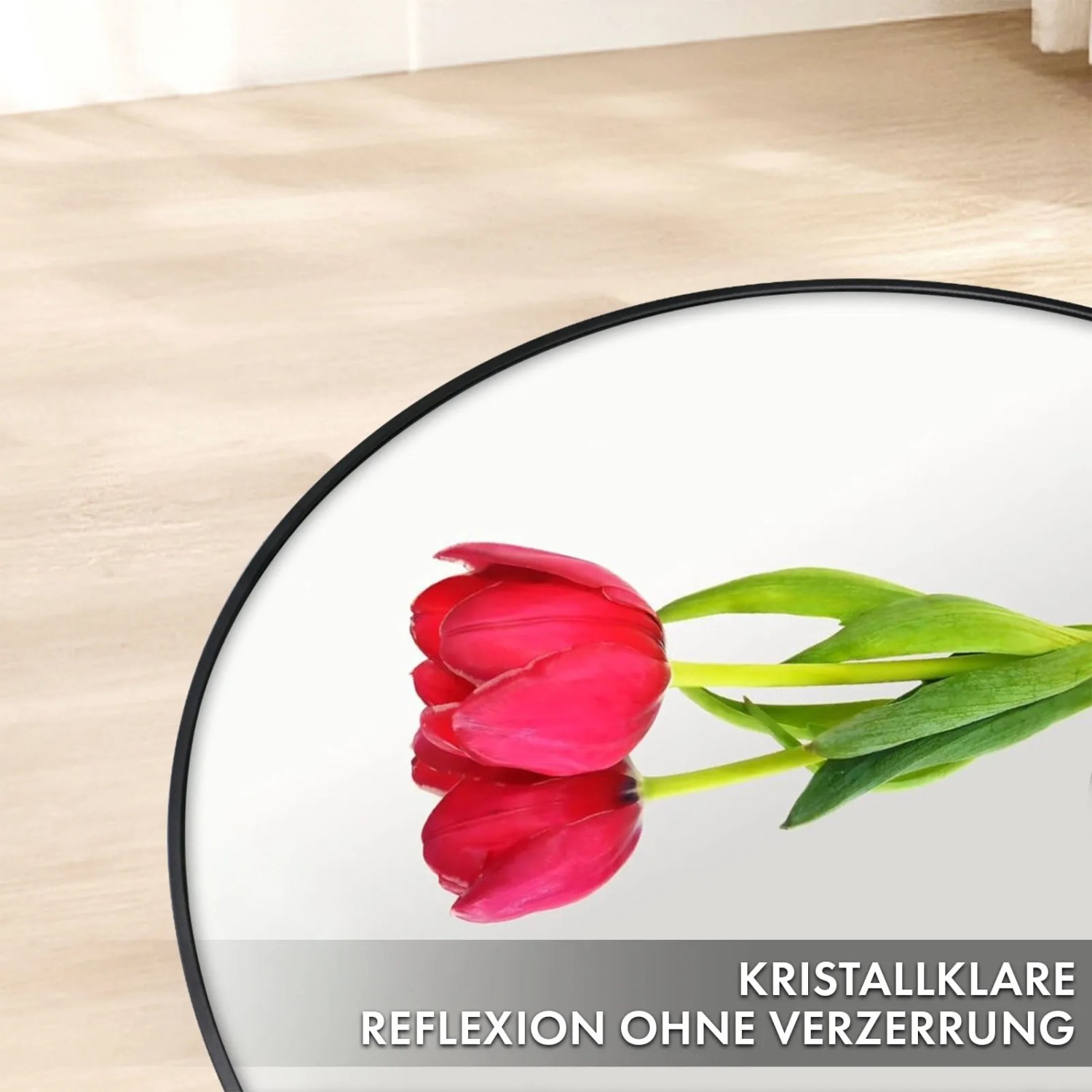 Runder Floordirekt Wandspiegel Bella mit schwarzem Rahmen und Tulpe im Spiegelbild.