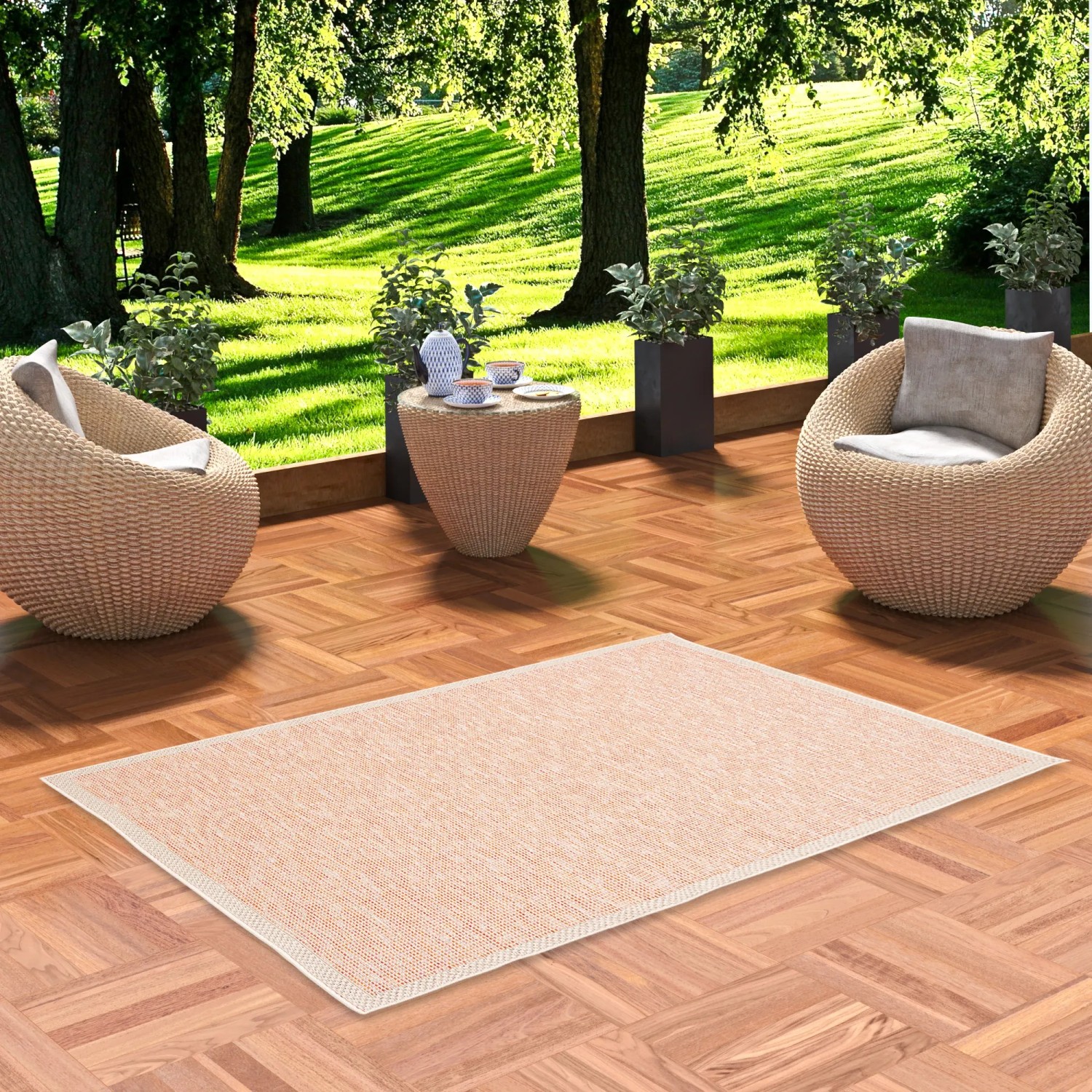 Terrakottafarbener Pergamon In & Outdoor Teppich Ottawa, 140x200 cm, auf einer Terrasse.