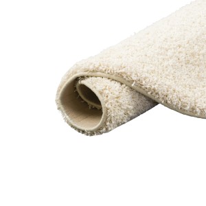 Gerollter, runder, creme-farbener Hochflor Teppich Milano (133x133cm).