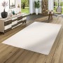 Weißer Snapstyle Hochflor Teppich Luna, 100x200cm, auf Holzboden in Wohnraum.