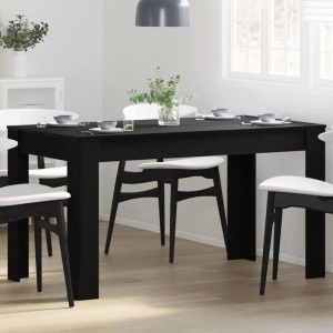 Schwarzer vidaXL Esstisch in Eichen-Optik, 140 cm, mit Stühlen in einem Esszimmer.