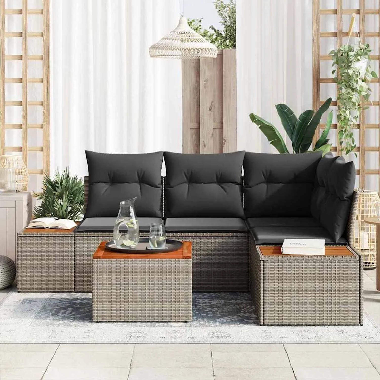 Graues 5-teiliges Garten-Sofa-Set aus Poly Rattan mit Kissen und Tisch.
