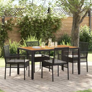 5-teiliges Garten Esszimmer Set mit schwarzen Poly Rattan Stühlen und Tisch.