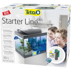 Tetra Starter Line LED Aquarium 30 l Komplettset im Karton, mit Zubehör und Kindern im Hintergrund.