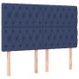 Blaues Boxspringbett 140x190 cm mit Stoffbezug und gestepptem Kopfteil.