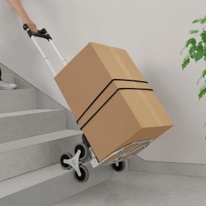 Klappbare Treppensackkarre mit Karton auf Treppe, inklusive Handschuhe und Packbänder.