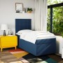 Blaues Boxspringbett (90x200 cm) mit Matratze und Kopfteil im Schlafzimmer.