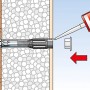 Abstandsmontagesystem Thermax 10/140: Dübel wird in gedämmte Fassade montiert.