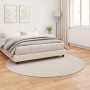 Beiger, runder vidaXL Kunstfell Teppich (Ø 160 cm) im Schlafzimmer.