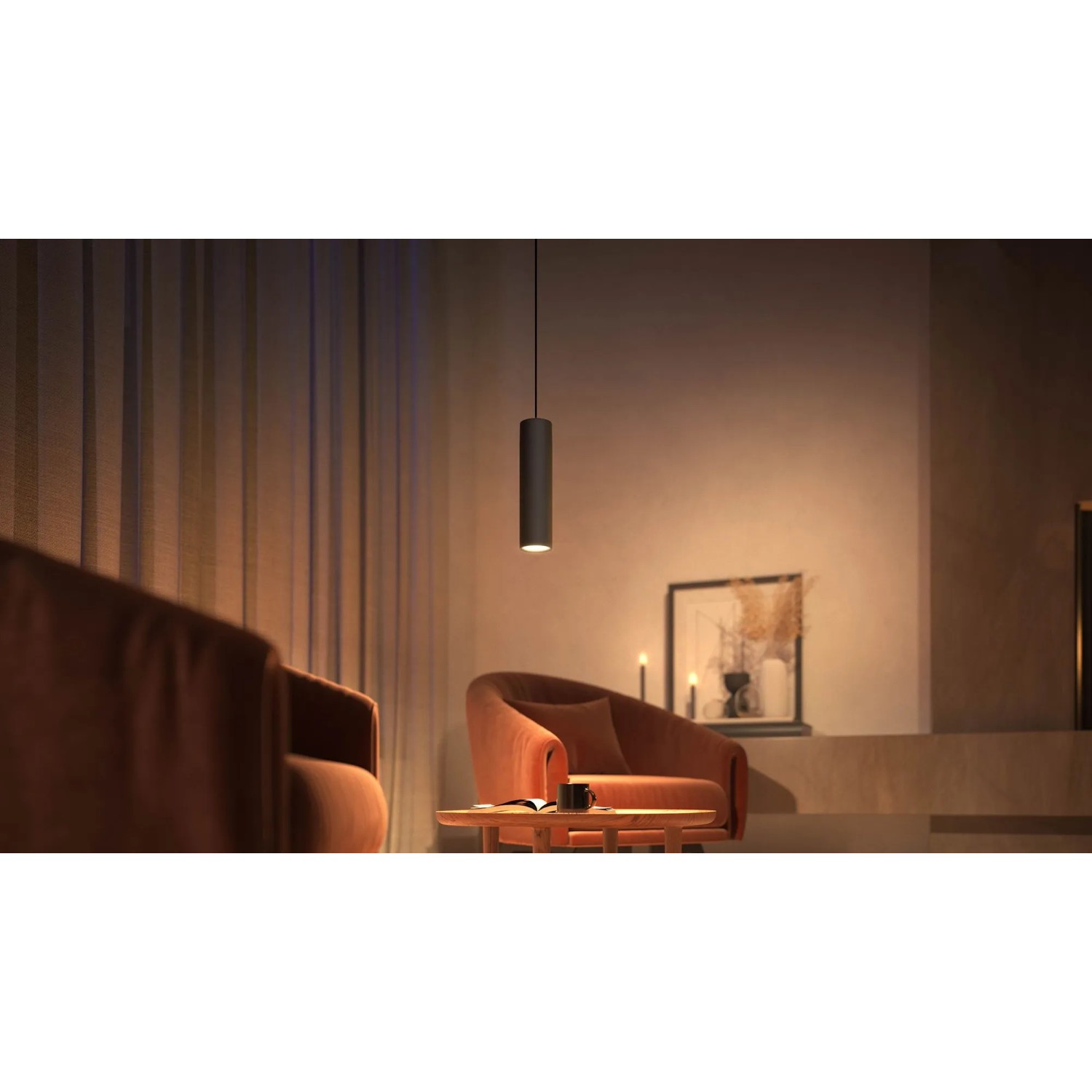Schwarze Philips Hue Perifo LED-Pendelleuchte als Schienensystem-Erweiterung in Wohnraum-Szene.