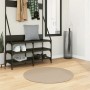 Runder sandfarbener Kurzflor-Teppich (Ø 80 cm) im Flur vor einer Garderobe. Weich und waschbar.