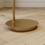Runder goldener Messingfuß der Lindby Bogenleuchte Cynthia auf hellem Holzboden. Moderne Stehlampe.