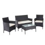 Schwarze 4-teilige Poly-Rattan Lounge-Garnitur mit creme Kissen und Tisch mit Glasplatte.