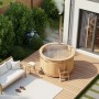 Finntherm Holz-Badefass Bergen mit Ofen, Ø 160 cm, auf Holzterrasse im Garten.