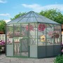Vitavia Vogelvoliere Circus 9000 Smaragd im Garten mit Blumen und Bäumen.