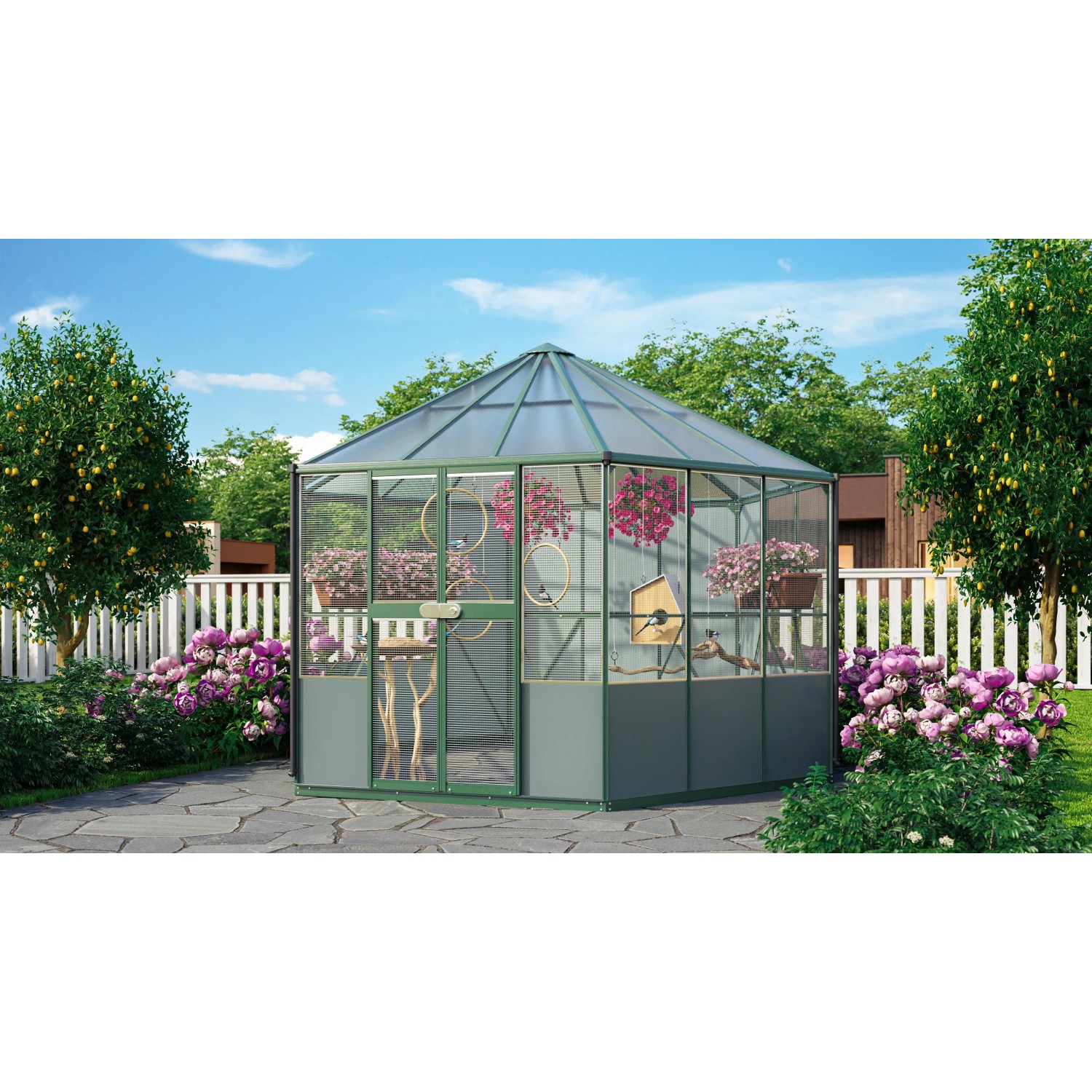 Vitavia Vogelvoliere Circus 9000 Smaragd im Garten mit Blumen und Bäumen.
