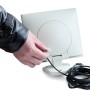 Lutec Solar LED-Strahler Sunshine: Hand stellt Sensor am Strahler ein.