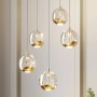 Moderne Lucande LED Pendelleuchte Hayley mit transparenten Glaskugeln, 5-flammig für Wohnzimmer.