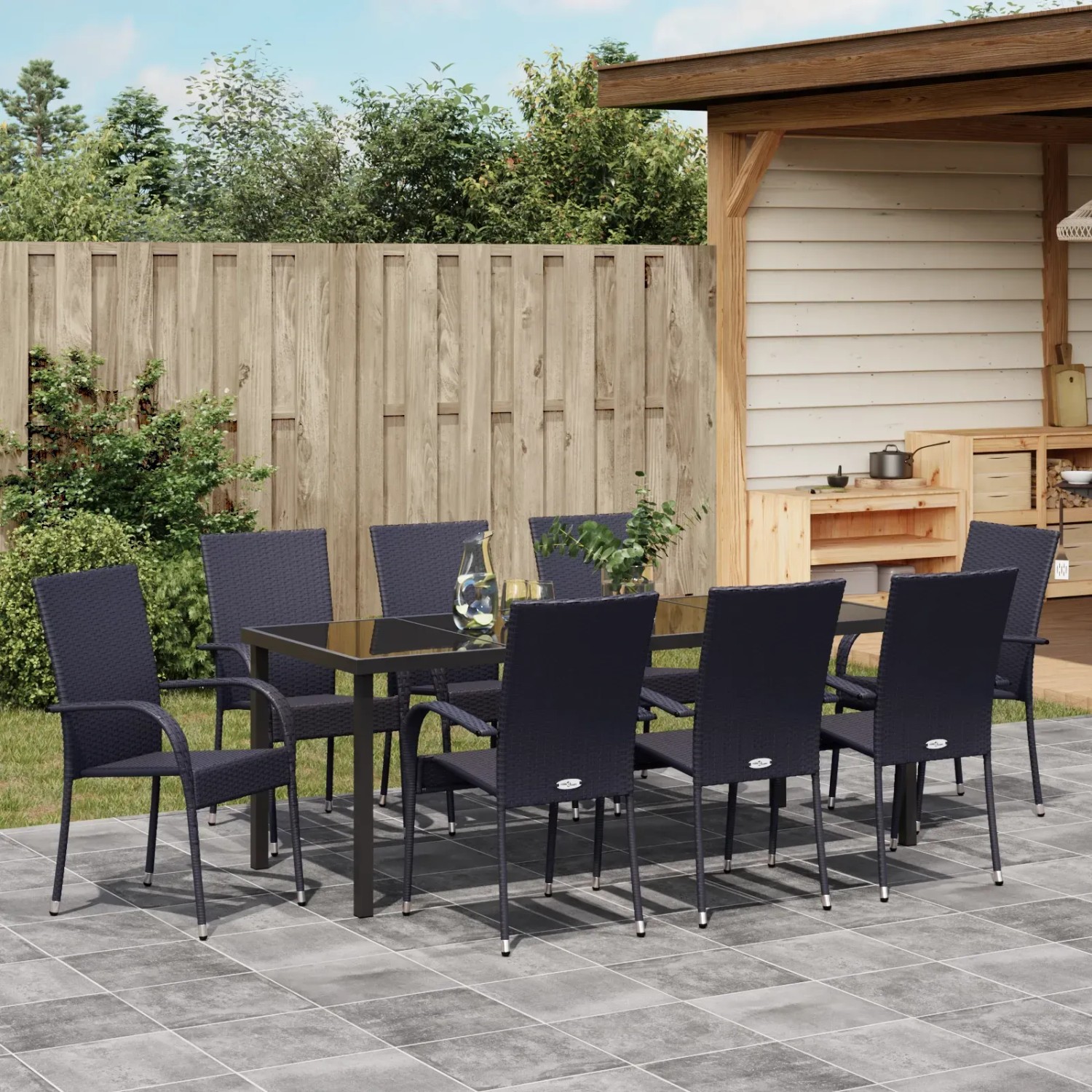 Schwarze 9-teilige vidaXL Garten Essgruppe aus Poly Rattan mit Tisch und Stühlen.