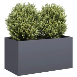 Anthrazitfarbener Pflanzkübel aus kaltgewalztem Stahl, gefüllt mit grünen Pflanzen. Für Garten & Terrasse.