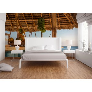 Fototapete Strandbar mit gelben und blauen Farbtönen, angebracht in einem Schlafzimmer.