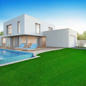 Sattgrüner Karat Kunstrasen Vita vor modernem Haus mit Pool. 40mm hoch, UV-beständig.