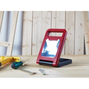 Faltbare LED-Arbeitsleuchte COB, 580 lm, rot/schwarz, mit Griff und Standfuß.