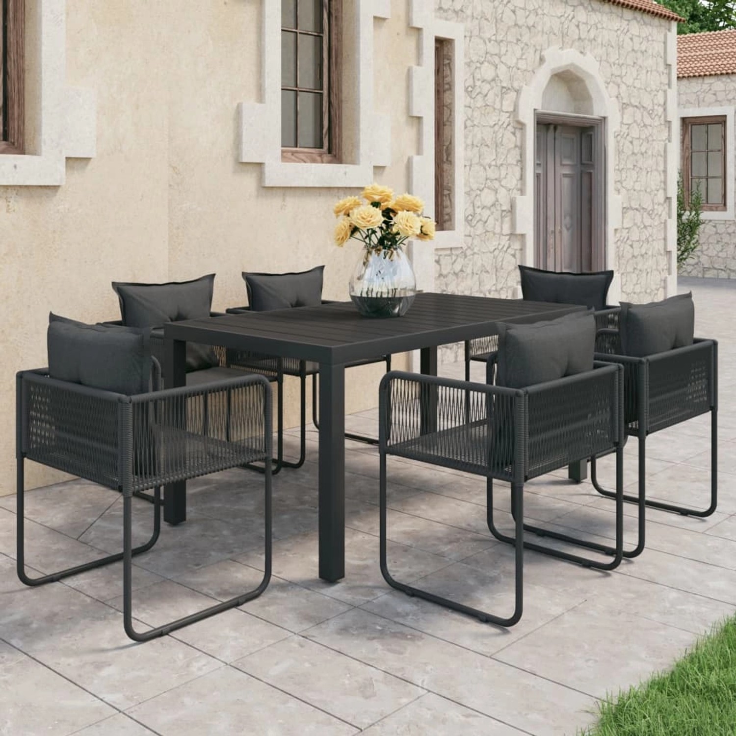 Schwarze 7-tlg. vidaXL Garten-Essgruppe aus PVC-Rattan mit Tisch und Stühlen mit Kissen.