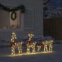 Drei goldene LED-Rentiere mit warmweißen Lichtern und roten Schleifen als Weihnachtsdekoration im Schnee vor einem Haus.