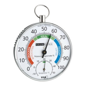 Weißes TFA Thermo-Hygrometer zur Raumklima-Kontrolle mit farbigen Komfortzonen und verchromtem Gehäuse.