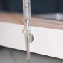Fix-o-moll Magnetscheibe, selbstklebend, Ø 19mm, silber, an einer weißen Oberfläche befestigt.