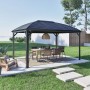 Anthrazitfarbener Sojag Pavillon Moreno 10x14 mit Tisch und Stühlen im Garten.