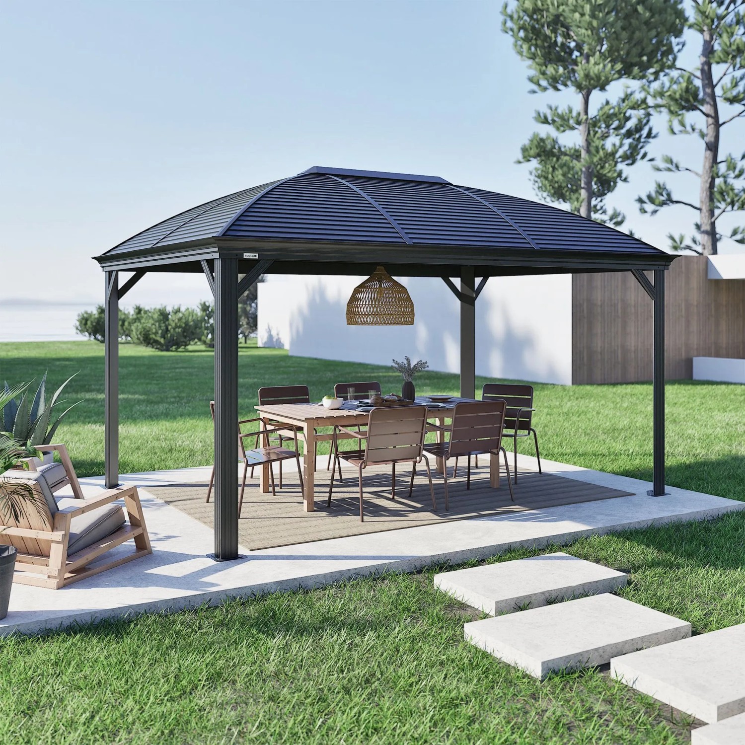 Anthrazitfarbener Sojag Pavillon Moreno 10x14 mit Tisch und Stühlen im Garten.