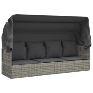Graues Outdoor-Loungebett mit Dach und Kissen aus Poly Rattan.