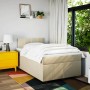 Cremefarbenes vidaXL Boxspringbett 120x190 cm mit Matratze und Kopfteil im Schlafzimmer.