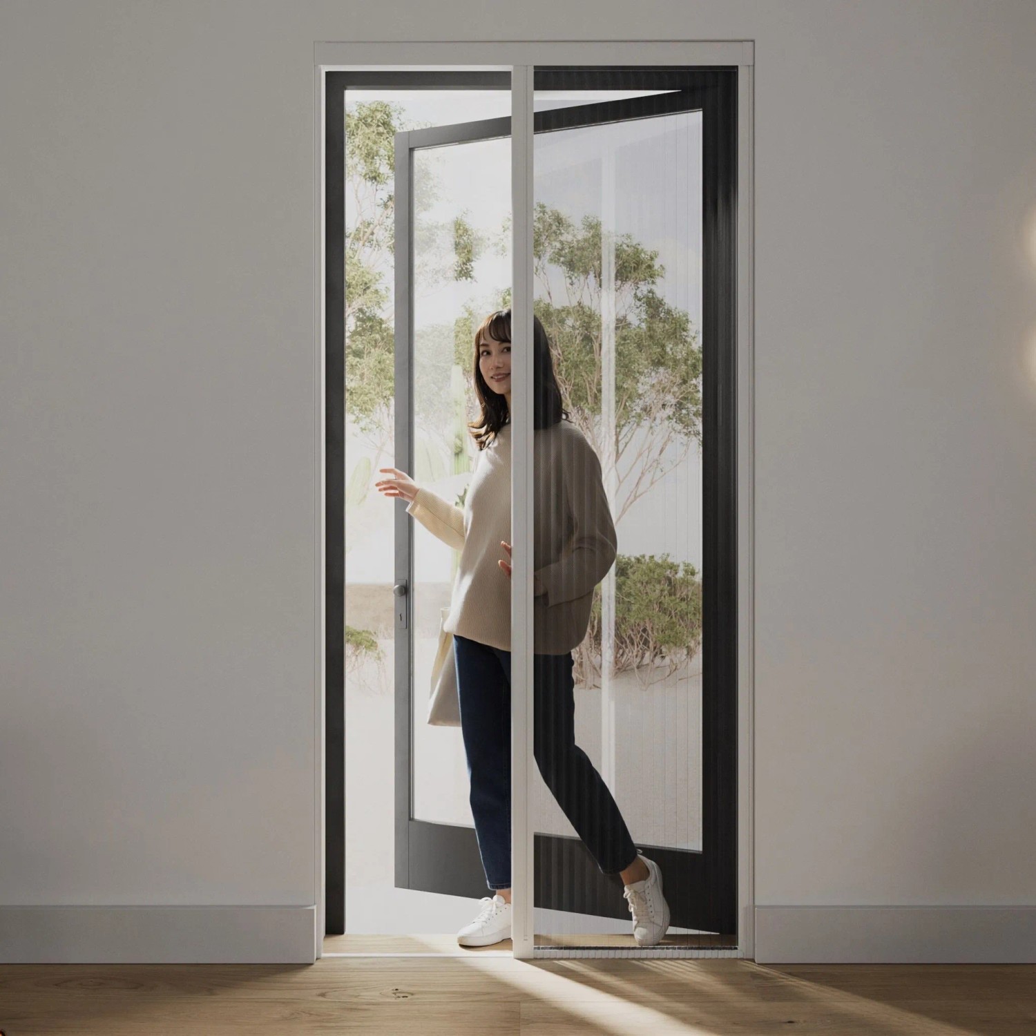 Weiße Cocoon Home Concepts Plissee Insektenschutztür mit seitlicher Öffnung im Türrahmen.