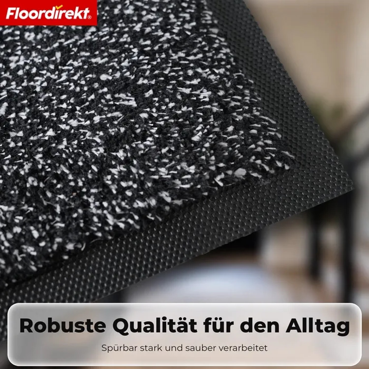 Nahaufnahme der Floordirekt Schmutzfangmatte KARAT, anthrazit meliert, mit strukturierter Oberfläche und rutschfester TPE-Rückseite.