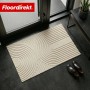 Beige Schmutzfangmatte CIRCA mit Wellenmuster, 40x60 cm, rutschfest und waschbar.