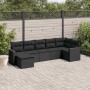 Schwarze 7-tlg. vidaXL Garten-Sofagarnitur aus Poly Rattan mit Kissen auf einer Terrasse.