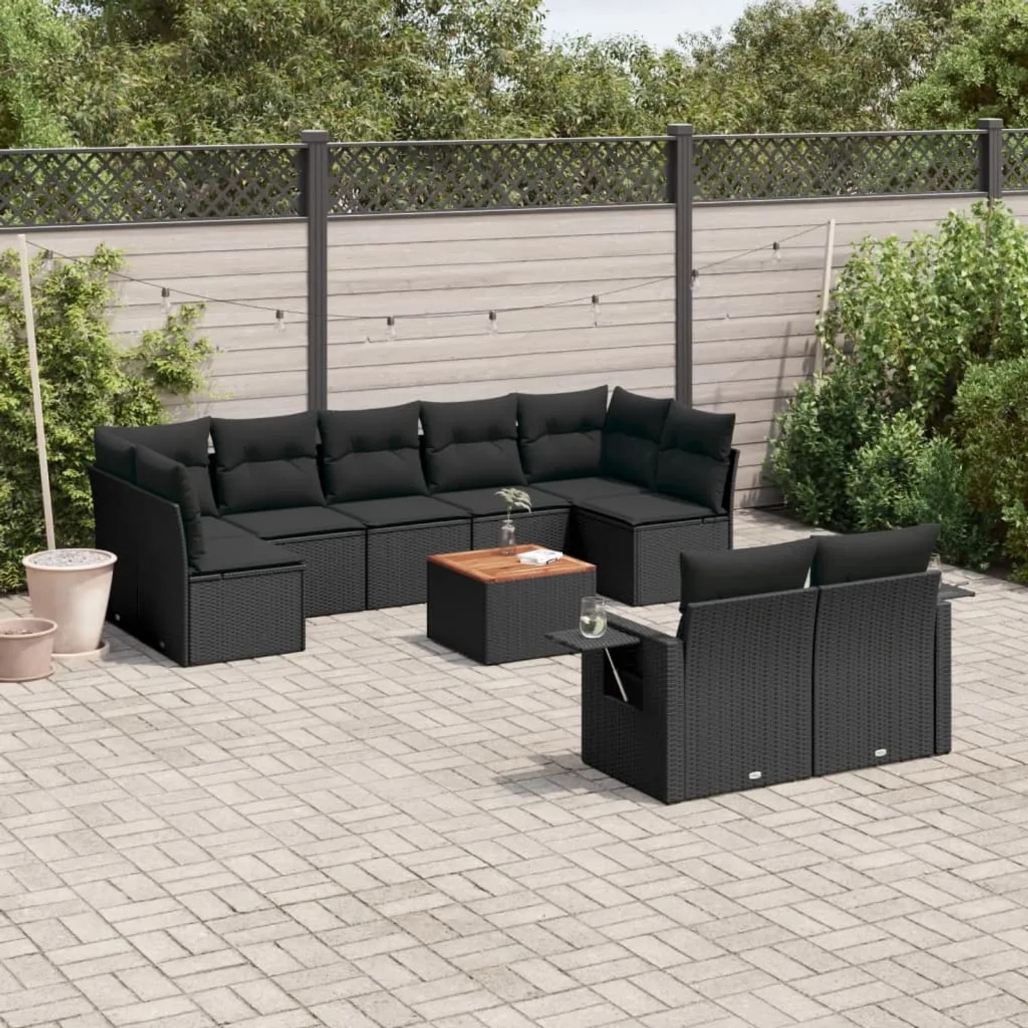 Schwarze 10-tlg. vidaXL Garten-Sofagarnitur aus Polyrattan mit Kissen und Tisch.