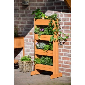 Hochbeet aus Kiefernholz mit 4 Pflanzkästen, bepflanzt mit Kräutern und Blumen.