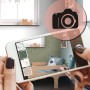 Hände halten Smartphone mit AR-Ansicht: Kinderzimmerwand mit olivgrüner Tapete, Bett. Weitere Tapetenmuster zur Auswahl.