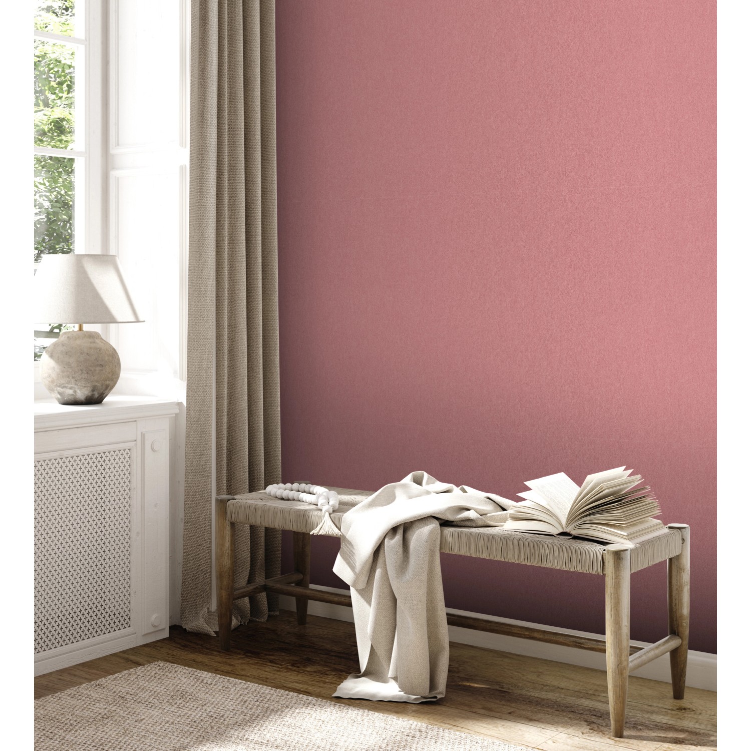 A.S. Création Vliestapete Uni Rosa an Wand im Wohnraum mit Bank und Deko.