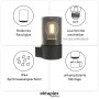 Anthrazitfarbene Oktaplex Puno Wandleuchte aus Aluminium mit Rauchglas und warmweißem E27 Leuchtmittel.