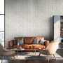Wohnraum mit grauer Steinoptik Tapete. PROFHOME Vliestapete mit leichter Struktur.