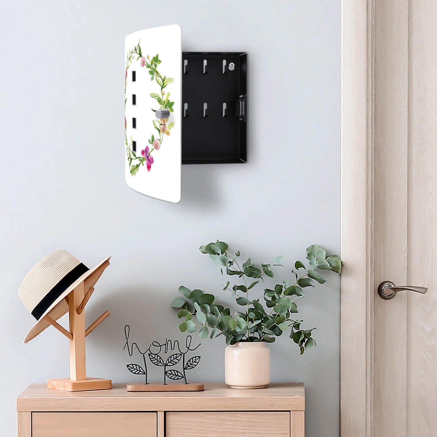 Banjado Schlüsselkasten Edelstahl mit Aquarell Blumenring Motiv, geöffnet an Wand montiert.